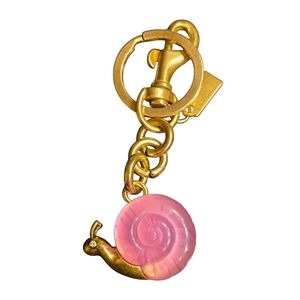 Whimsical Pink Snail Keychain with Gold Accents